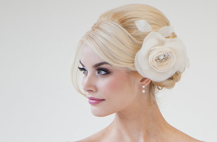 http://wedding-pictures.onewed.com/match/images/48792/wedding-hair-flowers-ivory-classic-chignon-wedding-hairstyle.original.png?1379137989