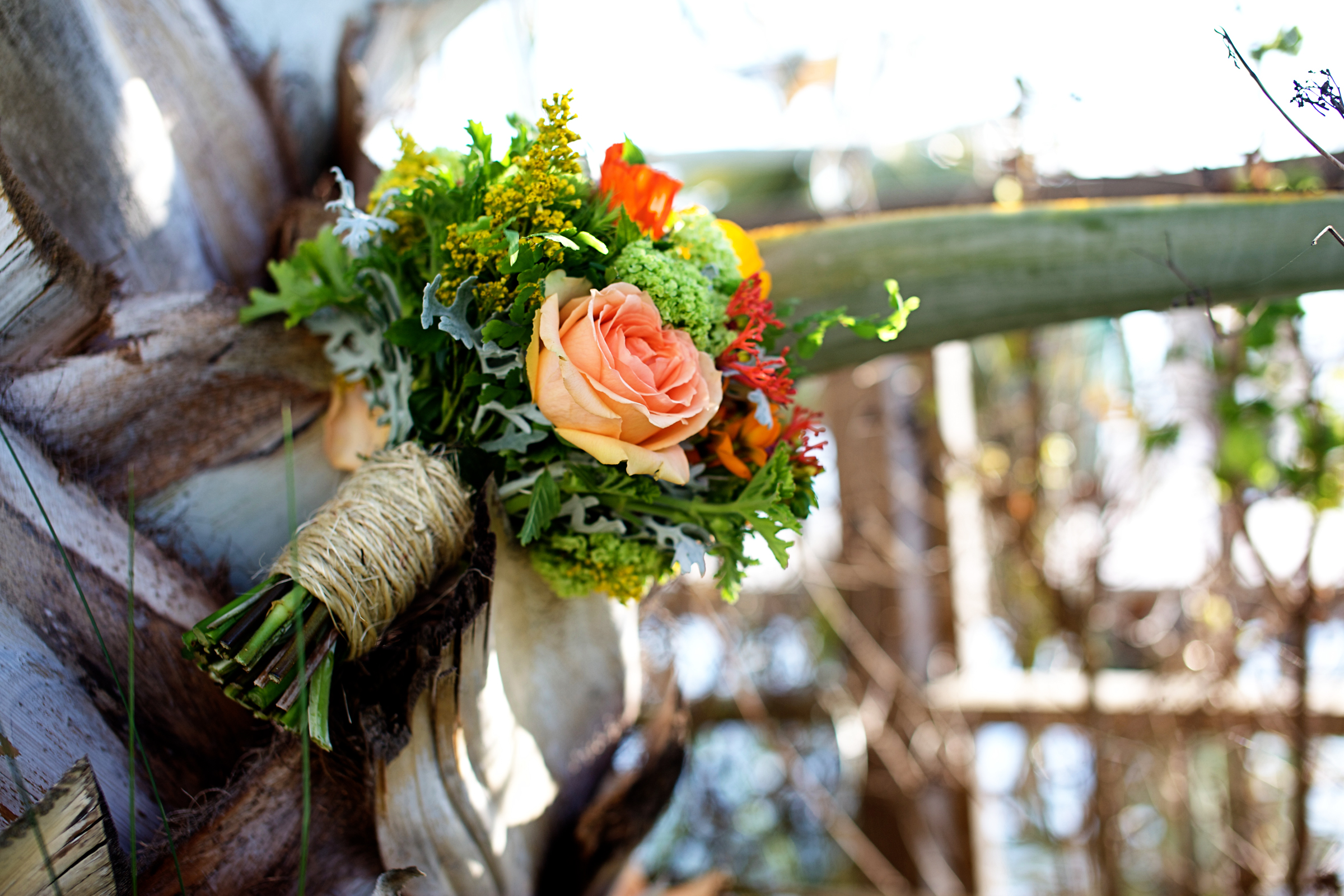 rustic wedding bridal bouquet peach roses twine