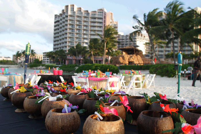 Madea destination wedding guests enjoying tropical drinks