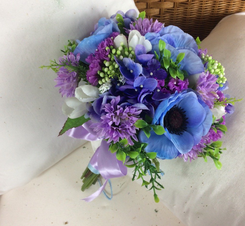 A brides bouquet of ivory lilac & blue artificial flowers