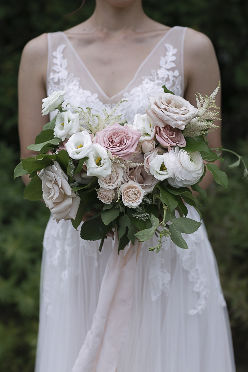 The bride and her bouquet in the Laurie Gardens
