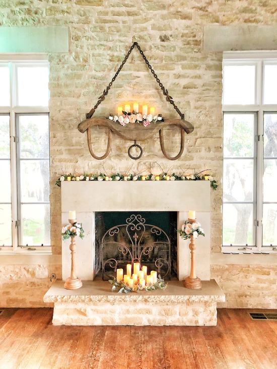 Custom built stone fireplace with candles & flowers