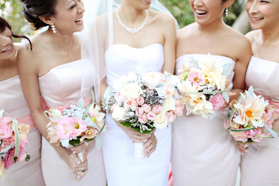 bride with bridesmaids light pink assorted bouquets