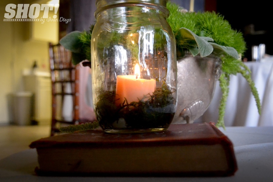 vintage wedding shoot with mason jar centerpieces votives moss